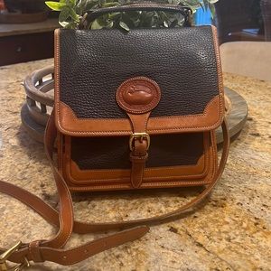 Vintage Dooney & Bourke pebbled navy and tan leather Surrey crossbody satchel.